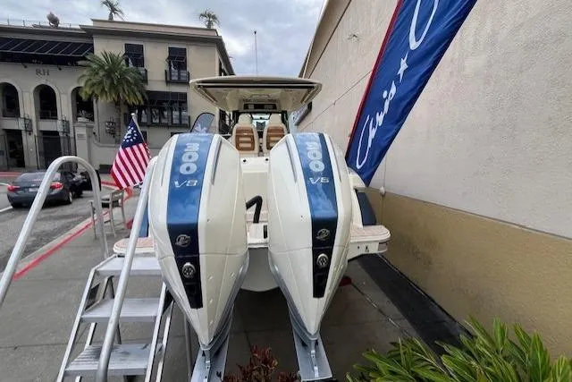 Slide: The Image of 2026 Chris-Craft Catalina 31 with twin V8 engines, displayed outdoors with American flag. - 7