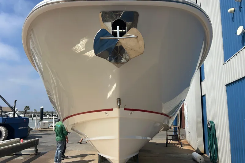 Slide: The Image of 2017 Boston Whaler 320 Vantage boat docked at marina, front view. - 11