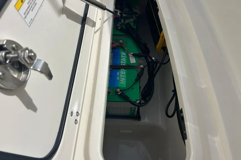 Slide: The Image of Battery compartment of 2017 Boston Whaler 320 Vantage boat, featuring Interstate battery. - 22