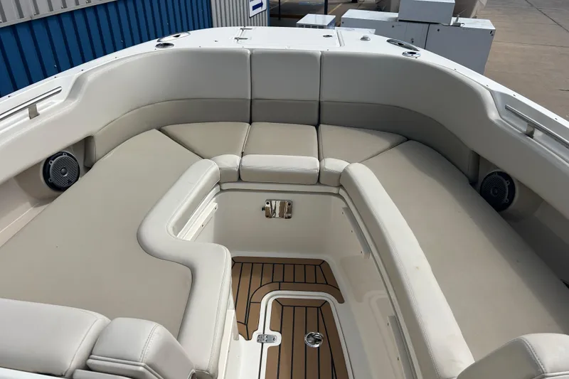 Slide: The Image of 2017 Boston Whaler 320 Vantage boat interior with cushioned seating and teak flooring. - 24