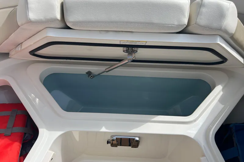 Slide: The Image of Open storage compartment on a 2017 Boston Whaler 320 Vantage boat. - 25