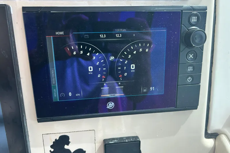Slide: The Image of Dashboard display of a 2017 Boston Whaler 320 Vantage boat, showing RPM and speed. - 36