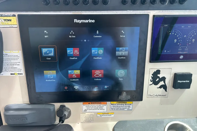 Slide: The Image of Control panel of a 2017 Boston Whaler 320 Vantage with Raymarine navigation display. - 37