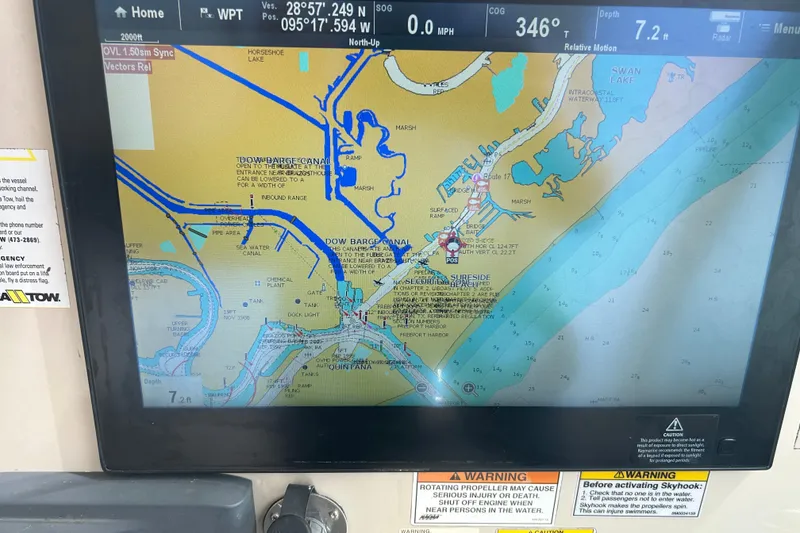 Slide: The Image of Navigation screen on a 2017 Boston Whaler 320 Vantage boat, displaying a detailed marine map. - 39