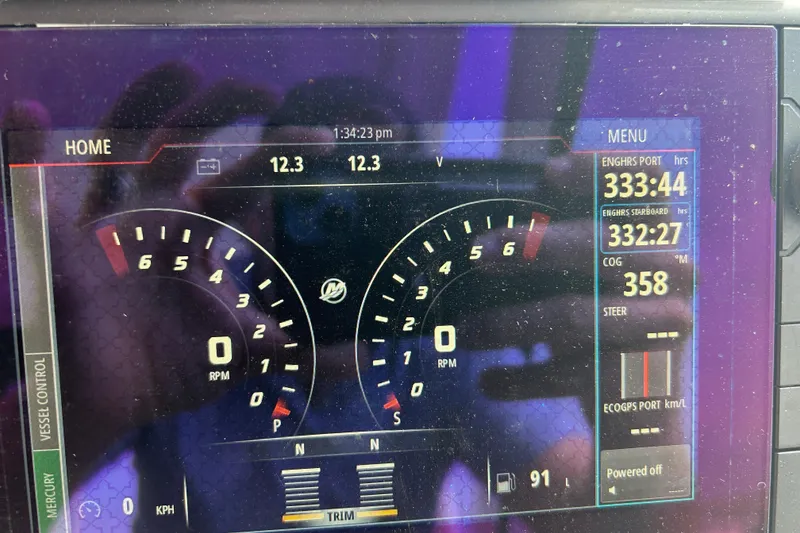 Slide: The Image of Dashboard of a 2017 Boston Whaler 320 Vantage boat showing engine hours and RPM. - 41
