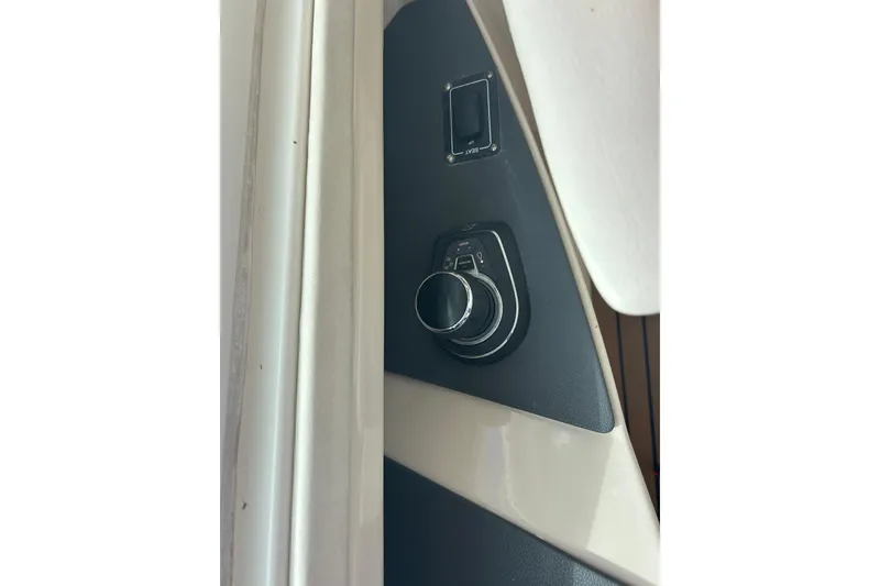 Slide: The Image of Control panel of 2017 Boston Whaler 320 Vantage boat, featuring a sleek design. - 43