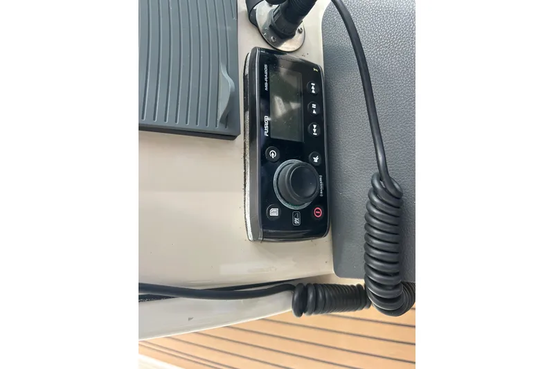 Slide: The Image of Control panel on a 2017 Boston Whaler 320 Vantage boat dashboard. - 44