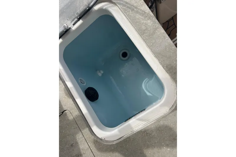 Slide: The Image of Livewell compartment on a 2017 Boston Whaler 320 Vantage boat. - 45