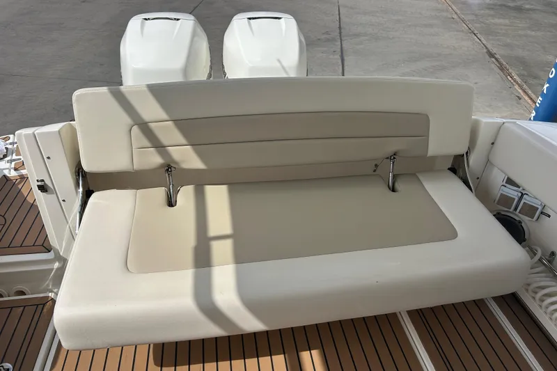 Slide: The Image of 2017 Boston Whaler 320 Vantage boat seating area with dual engines. - 52