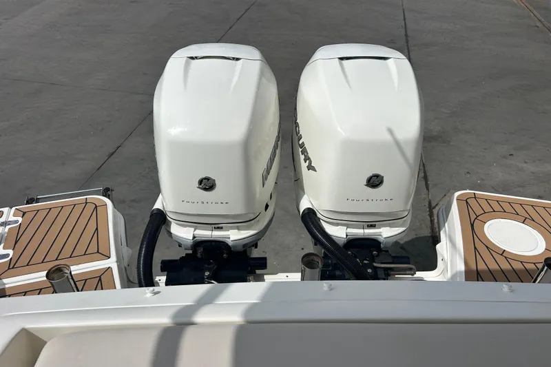 Slide: The Image of Twin Mercury FourStroke engines on a 2017 Boston Whaler 320 Vantage boat. - 53