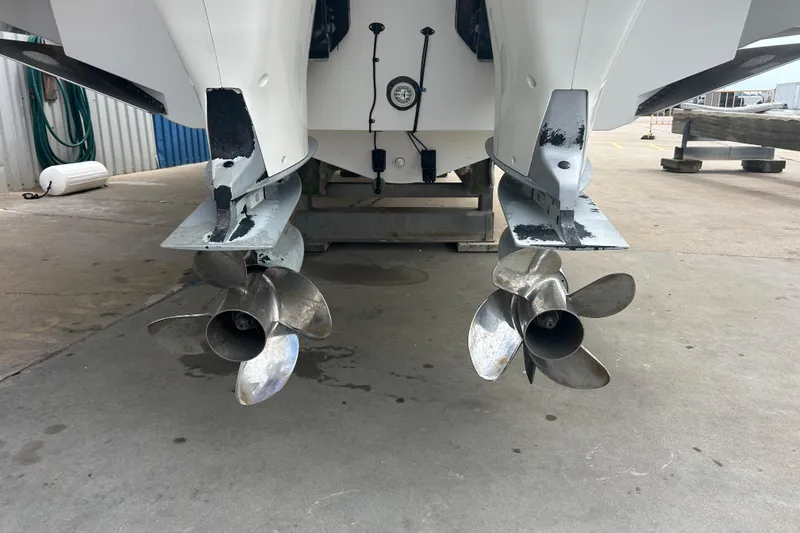 Slide: The Image of 2017 Boston Whaler 320 Vantage boat propellers on dry dock. - 54