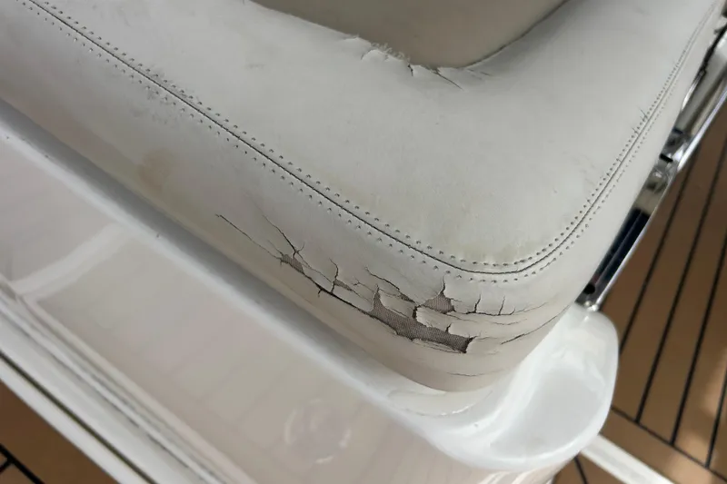 Slide: The Image of Cracked seat upholstery on 2017 Boston Whaler 320 Vantage boat. - 59