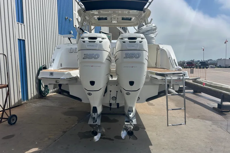 Slide: The Image of 2017 Boston Whaler 320 Vantage with twin 350 engines at dockside. - 8