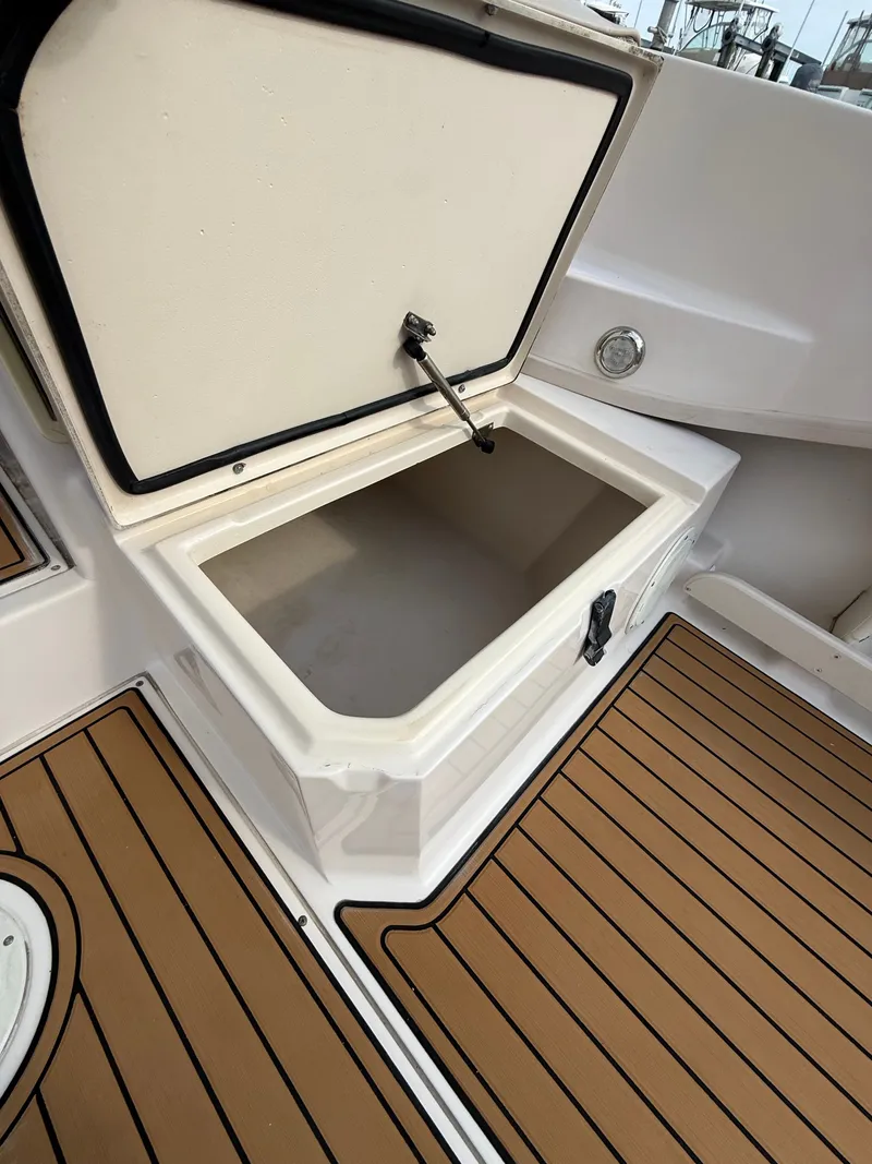 Slide: The Image of Open storage compartment on a 2001 Grady-White Gulfstream 232 boat. - 19