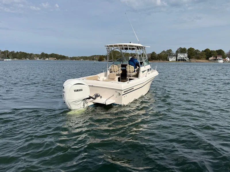 Slide: The Image of 2001 Grady-White Gulfstream 232 boat on calm water. - 2