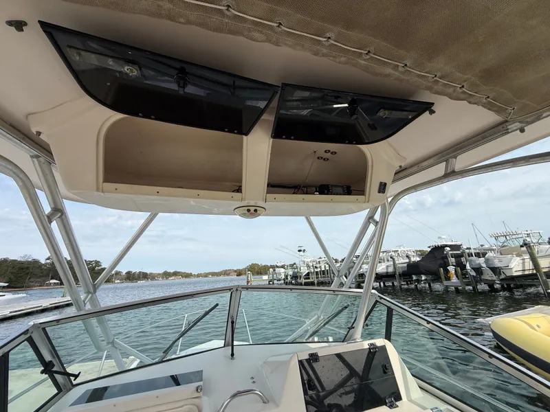 Slide: The Image of Interior view of a 2001 Grady-White Gulfstream 232 boat at the marina. - 21