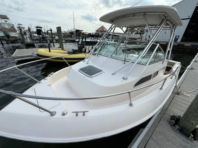 Slide: The Image of 2001 Grady-White Gulfstream 232 boat docked at marina. - 29