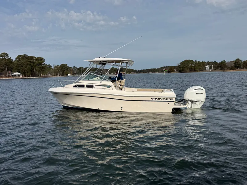 Slide: The Image of 2001 Grady-White Gulfstream 232 boat on calm water. - 6