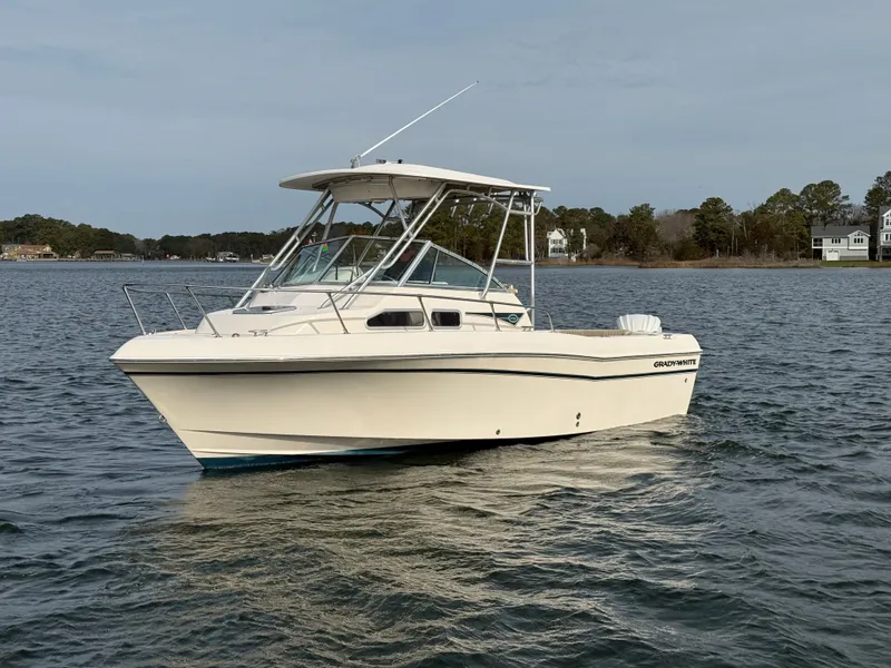 Slide: The Image of 2001 Grady-White Gulfstream 232 boat on calm water. - 7