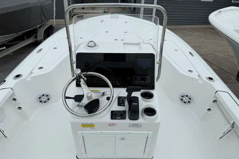 The Image of 2026 Tidewater 1910 Bay Max boat console with steering wheel and controls. - 1