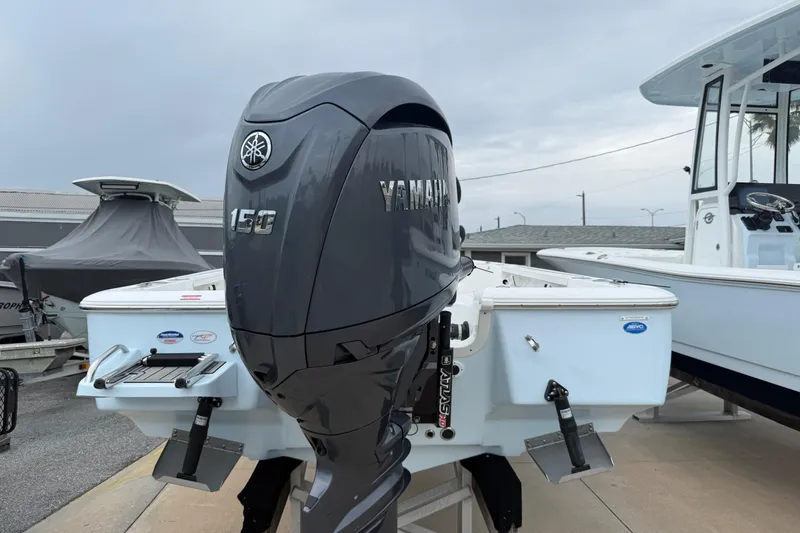 Slide: The Image of 2026 Tidewater 1910 Bay Max boat with Yamaha 150 outboard motor, displayed outdoors. - 11