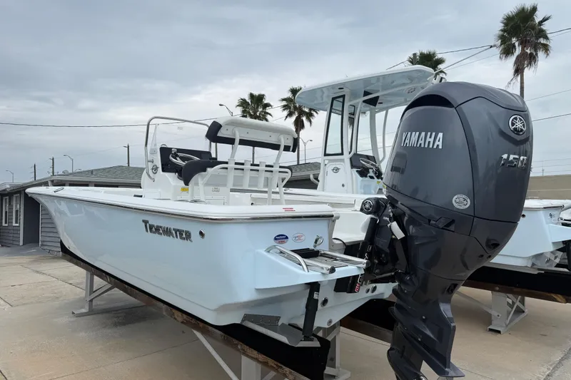 Slide: The Image of 2026 Tidewater 1910 Bay Max boat with Yamaha 150 engine, displayed outdoors. - 12