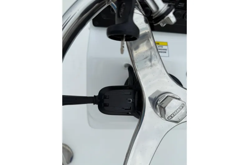 Slide: The Image of Steering wheel and ignition of 2026 Tidewater 1910 Bay Max boat. - 5