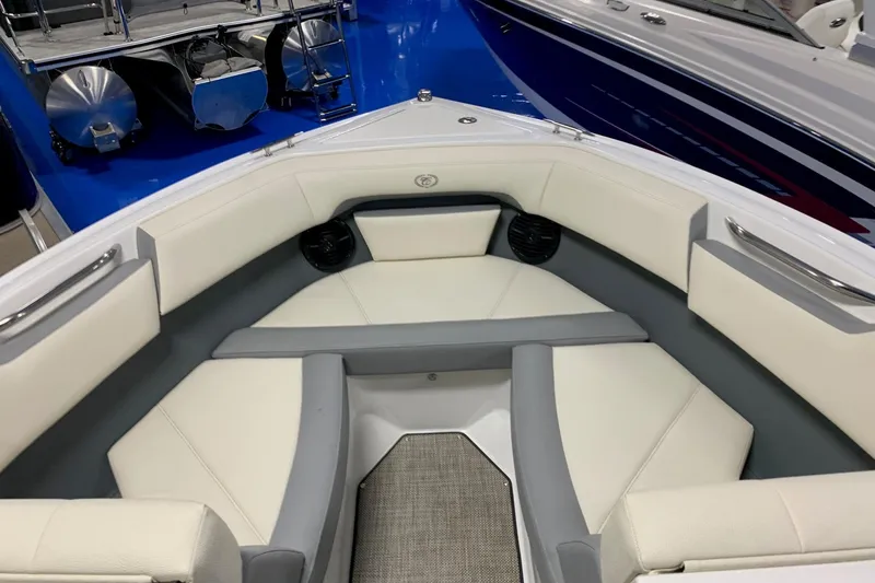 Slide: The Image of 2019 Cobalt CS22 boat interior with white and gray seating, showcasing luxury design. - 2