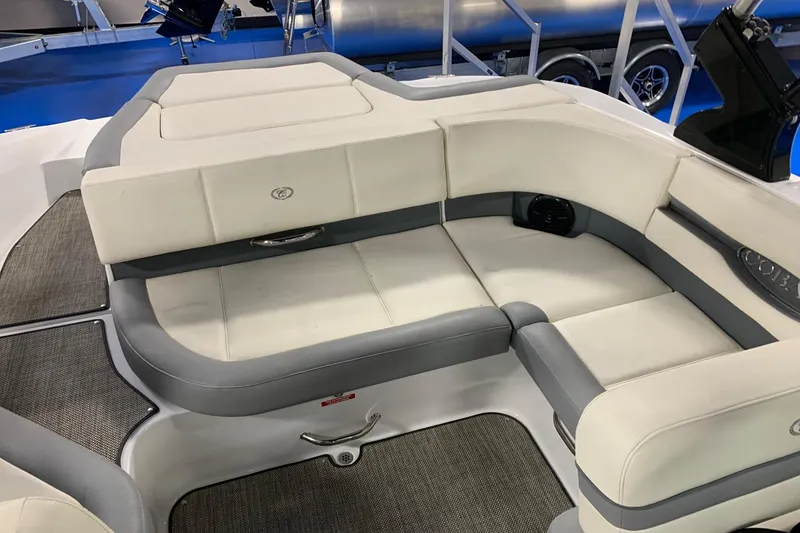 Slide: The Image of 2019 Cobalt CS22 boat interior with white and gray cushioned seating. - 3