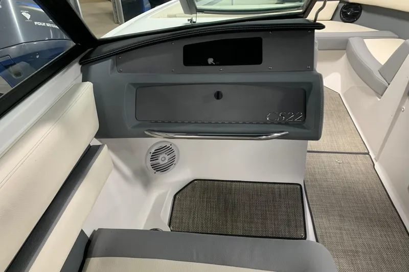 Slide: The Image of Interior of a 2019 Cobalt CS22 boat, featuring seating and speaker. - 4