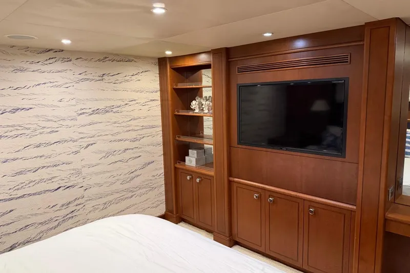 Slide: The Image of Luxurious Heesen 144 yacht interior with wood paneling and built-in TV, 1990 model. - 101