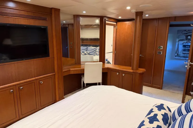 Slide: The Image of Luxurious Heesen 144 yacht bedroom interior with wood paneling and modern amenities, 1990 model. - 102