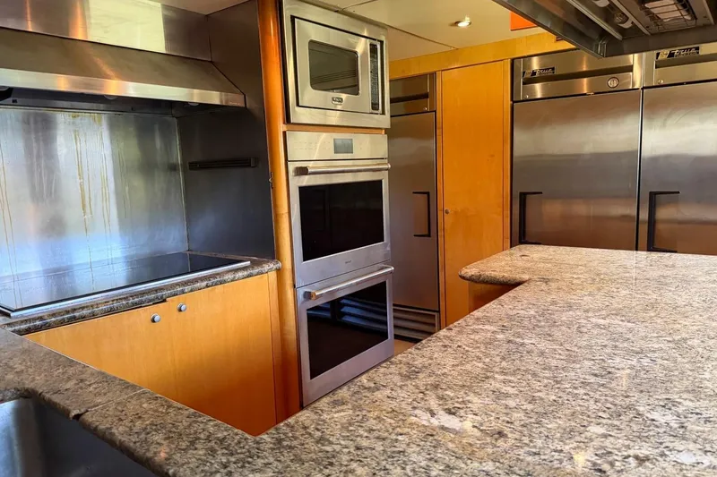 Slide: The Image of Luxurious yacht kitchen with stainless steel appliances and granite countertops, Heesen 144, 1990 model. - 108