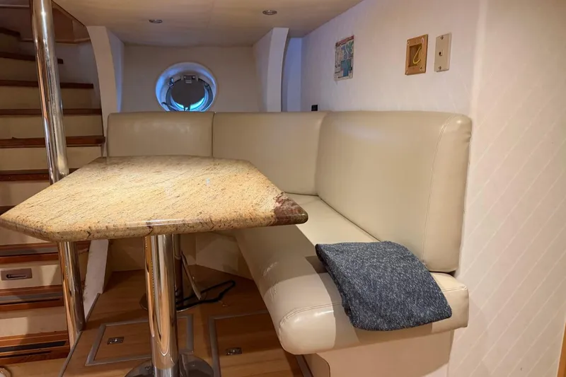 Slide: The Image of Luxurious Heesen 144 yacht interior with beige seating and granite table, 1990 model. - 115
