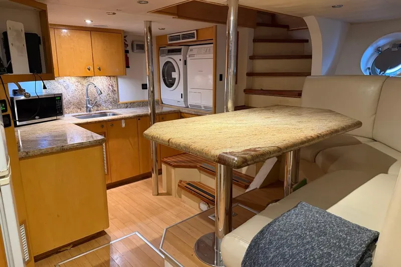 Slide: The Image of Luxurious 1990 Heesen 144 yacht interior with kitchen, dining area, and modern amenities. - 116