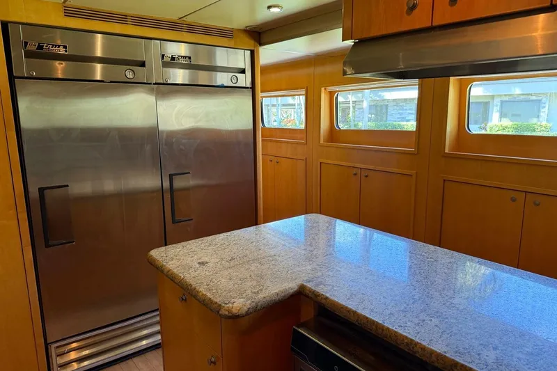 Slide: The Image of Luxurious kitchen interior on 1990 Heesen 144 yacht with stainless steel appliances. - 117