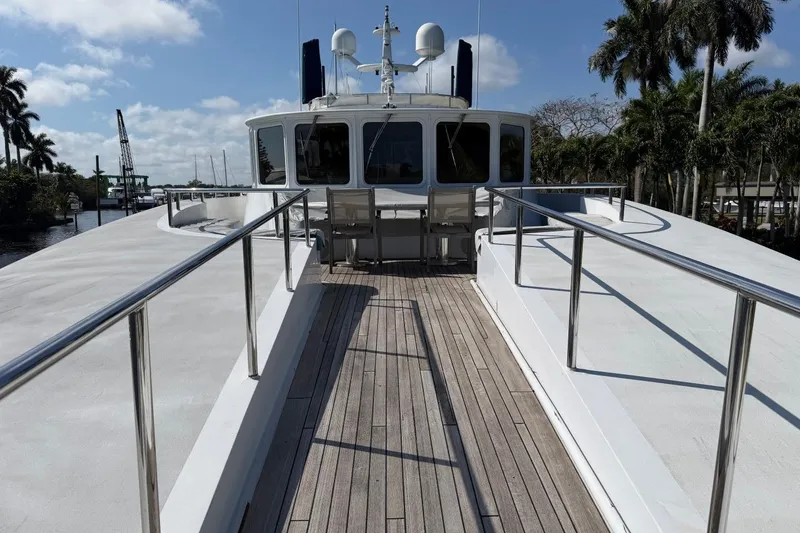 Slide: The Image of Heesen 144 yacht deck, 1990 model, featuring sleek design and modern amenities. - 12