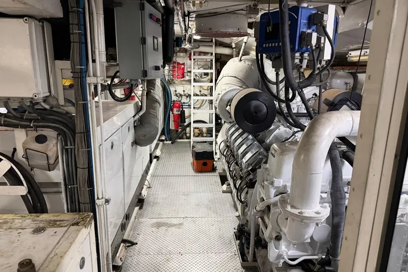 Slide: The Image of Engine room of a 1990 Heesen 144 yacht, showcasing machinery and equipment. - 127