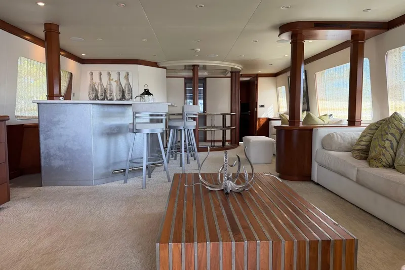 Slide: The Image of Luxurious interior of 1990 Heesen 144 yacht with modern bar and elegant seating area. - 13