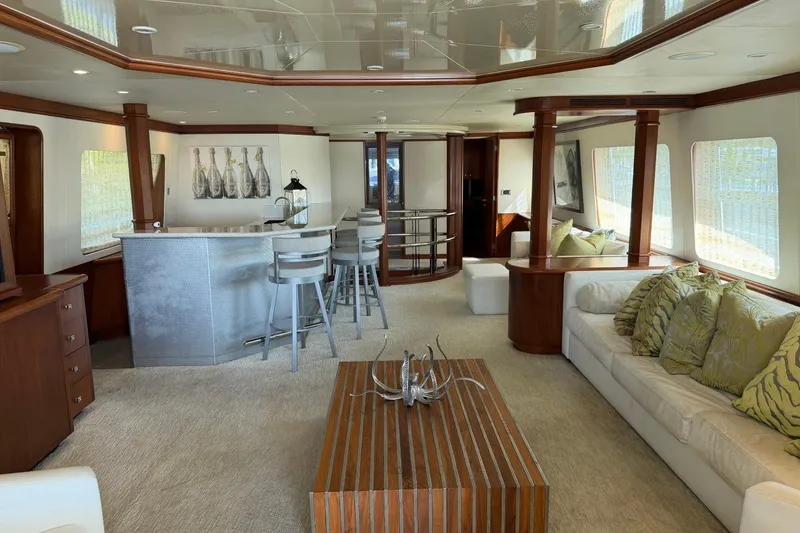 Slide: The Image of Luxurious interior of 1990 Heesen 144 yacht with elegant bar and seating area. - 14
