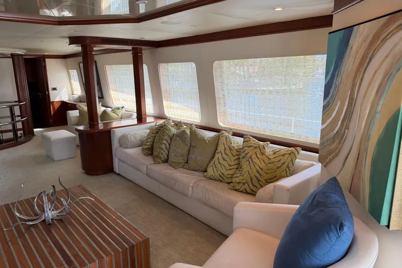 Slide: The Image of Luxurious Heesen 144 yacht interior with elegant seating, abstract art, and natural light. - 16
