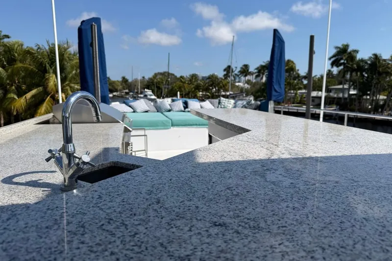 Slide: The Image of Luxurious Heesen 144 yacht deck with granite countertop and outdoor seating, 1990 model. - 23