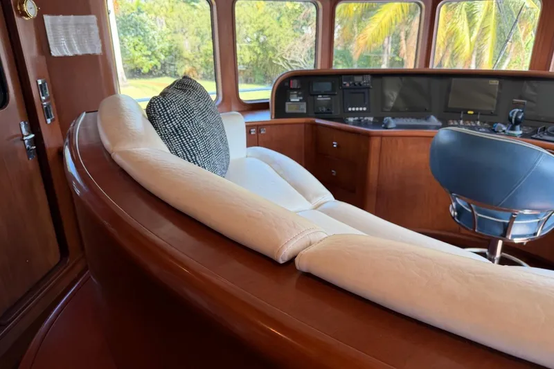 Slide: The Image of Luxurious interior of 1990 Heesen 144 yacht with plush seating and control panel. - 25