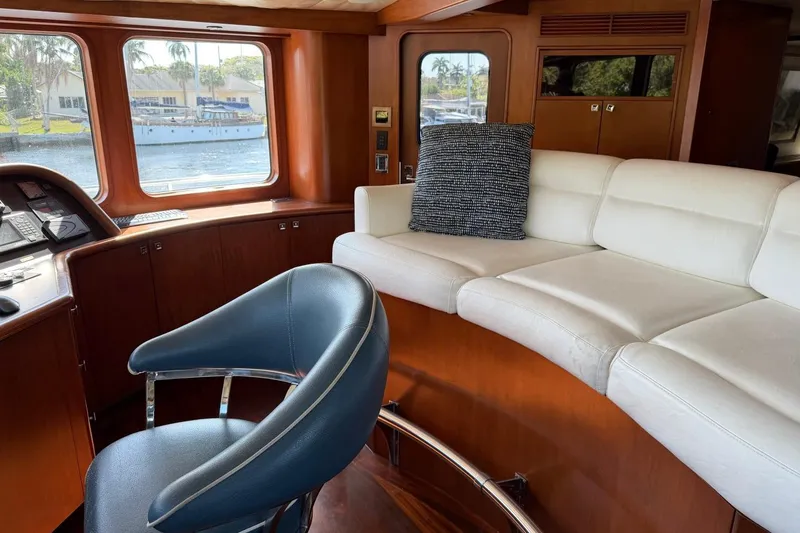 Slide: The Image of Luxurious interior of 1990 Heesen 144 yacht with plush seating and scenic window view. - 30