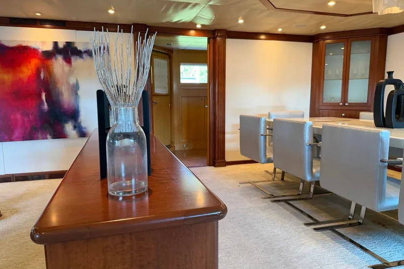 Slide: The Image of Luxurious Heesen 144 yacht interior, featuring elegant dining area and modern art, built in 1990. - 33