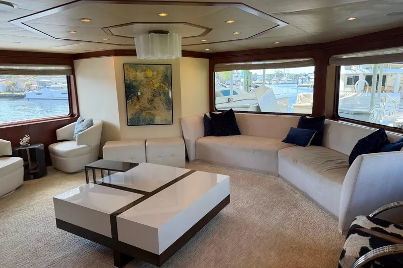 Slide: The Image of Luxurious yacht interior with modern decor, large windows, and elegant seating on a 1990 Heesen 144. - 40