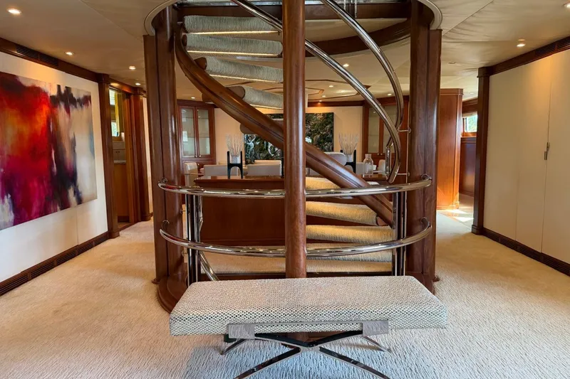 Slide: The Image of Luxurious interior of 1990 Heesen 144 yacht with elegant spiral staircase and modern art. - 41