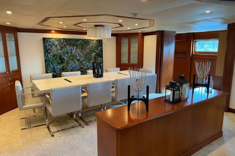 Slide: The Image of Luxurious dining area on a 1990 Heesen 144 yacht with elegant decor and modern furnishings. - 44