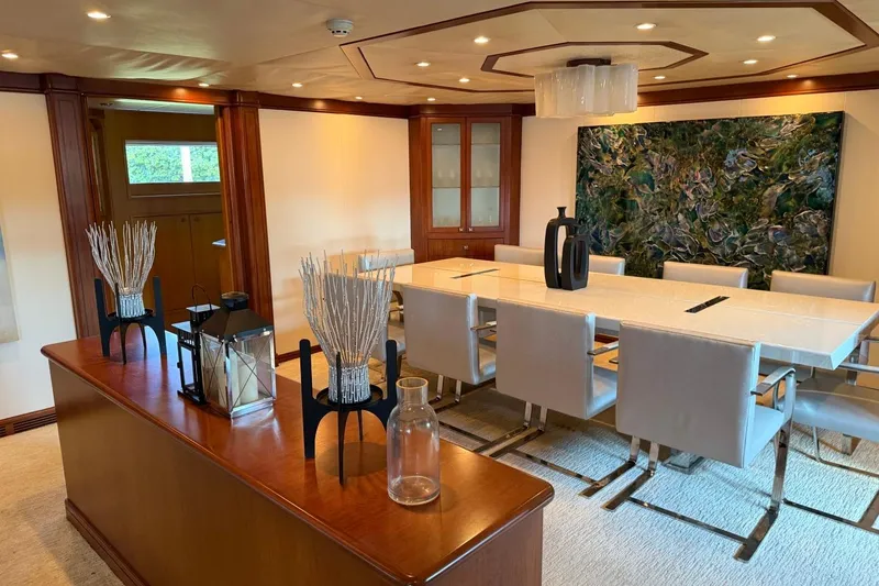 Slide: The Image of Luxurious dining area on 1990 Heesen 144 yacht with elegant decor and modern art. - 45