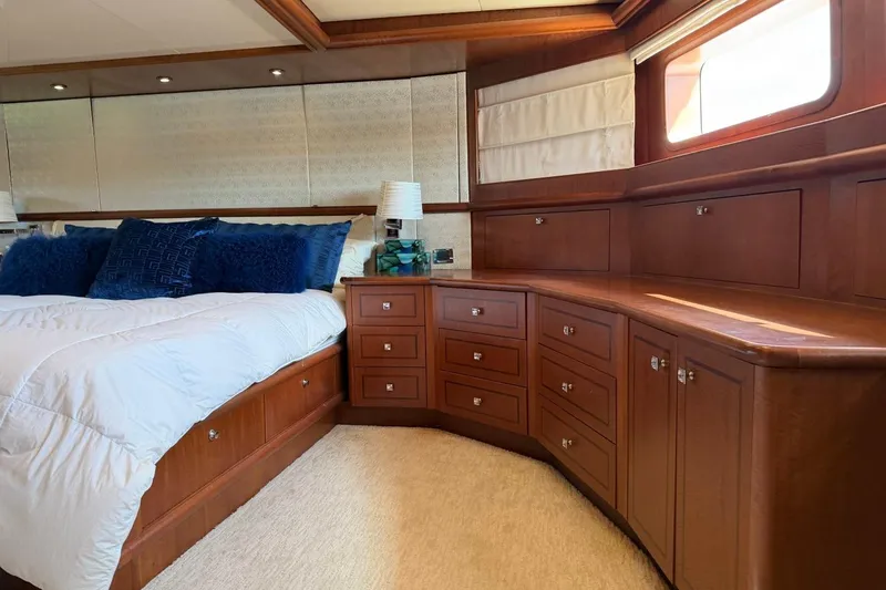 Slide: The Image of Luxurious bedroom interior of 1990 Heesen 144 yacht with elegant wood cabinetry and plush bedding. - 50